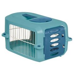 the small dog cage is blue and has an opening for it's door to go inside