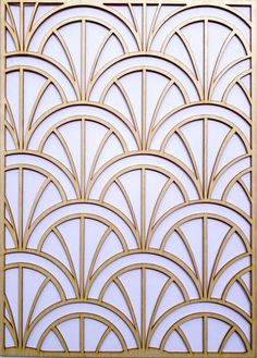 an art deco wall panel in gold and white