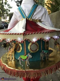 a merry go round with lights and decorations on it