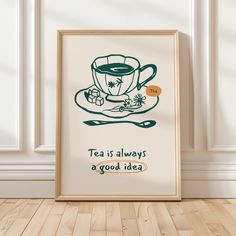 a tea is always a good idea poster hanging on the wall next to a wooden floor