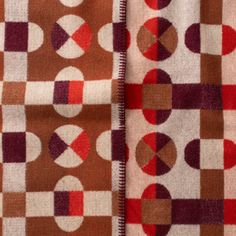 two pieces of fabric with circles and dots on them, one is brown and the other is red