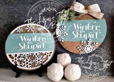 "Embrace the whimsy of winter with our round sign boldly declaring, \"Winter Is Stupid!\" Choose your display preference: hang it proudly or prop it on an easel (not included) for a touch of seasonal sass! Perfect for those who want to add a dash of humor to their winter décor.  Measures approx 9\" round. Choose from top/bottom snowflake design or bow/greenery design" Winter Door Signs With Trees, Winter Wonderland Door Hangers, Winter Ornament Door Hanger, Please Don't Snow Door Hangers, Simple Winter Door Hangers, Winter Door Hangers Deer Hunter, Cricut Door Signs Winter, Winter Door Signs Entrance, Cricut Winter Door Sign