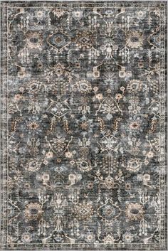 an area rug with various colors and patterns on the carpet, including greys, browns,