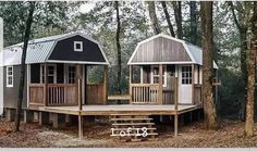 two tiny houses in the woods surrounded by trees