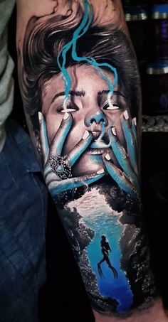 a man's arm with an image of a woman holding her face in front of him