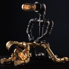 an image of a camera that is made out of metal pipes and brass fittings