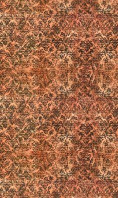 an orange and brown area rug with many different colors