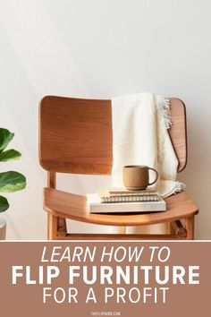 a wooden chair sitting next to a potted plant