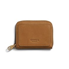 Crafted from premium natural leather, this wallet features a zip around closure to keep your personal items secure and an exterior card pocket with our signature detailing.  | Shinola Women's Pocket Small Zip Around Wallet Corner Store, Natural Tan, Small Leather Goods, Collar And Leash, Bag Straps, Corporate Gifts, Natural Leather, Wallets For Women, Tech Accessories