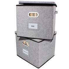 two grey storage boxes with labels on them