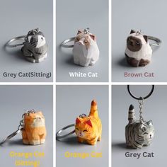 six different keychains with cats on them, all in different shapes and sizes