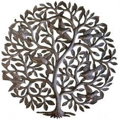 a metal tree with birds sitting on it's branches and leaves in the shape of a circle