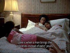 two women laying in bed with the caption love is when a man brings the groceries instead of eatin'yours