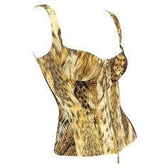 Presenting a beautiful Roberto Cavalli leopard animal print bustier corset top. From 2003, this animal print top features a zip closure at the front, a square neckline, an adjustable corset tie at the back, and embroidered accents at the sides. It does not get more iconic than an early 2000s Cavalli animal print corset. Get your hands on this Y2K dream while it's available! Approximate measurements: Size - XS Bust: 30” Waist: 25” Shoulder to hem: 19.5” Roberto Cavalli Corset, Vintage Roberto Cavalli, Leopard Print Fashion, Vintage Ysl, Versace Couture, Coral Print, Snake Print Dress, Corset Bustier, Silk Lace