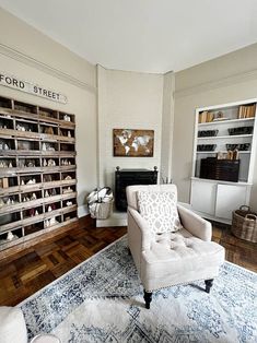 a living room filled with furniture and lots of shelves