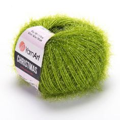 a ball of yarn that is green and has been dyed with the words yarn art christmas on it