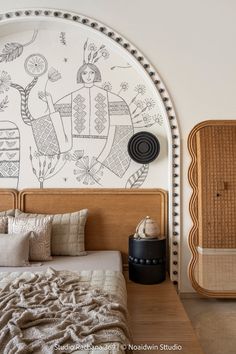 a bed room with a neatly made bed and a decorative wall hanging on the wall