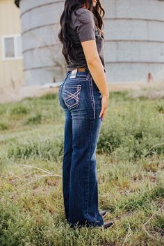 Meet the Ariat Entwined Trouser - a cowgirl's dream! These jeans, made by Ariat, are not only comfortable thanks to their soft denim, but also have a flattering boot cut and mid rise fit. Embrace your inner cowgirl and look effortlessly stylish in the Entwined Trouser. Inseam: Regular-33" Long-35" Rise: 8 1/2" Ariat Bootcut Jeans, Cow Girl Jeans, Ariat Jeans Womens Outfit, Ariat Outfits, Curvy Western Outfits, Cowgirls Outfits, Ariat Clothing, Ariat Jeans