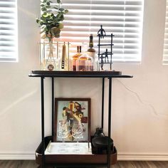 a table with bottles and glasses on it