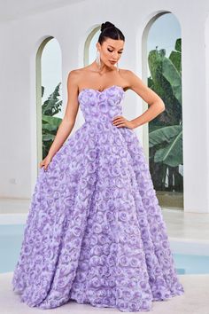 This gown is a masterpiece of tailoring, featuring precise lines and a stunning 3-dimensional floral pattern throughout. The midrise back and concealed zipper closure provide a seamless look, while the strapless bodice and sweetheart neckline add a touch of romance. The A-line silhouette flows gracefully, culminating in a delicately shaped skirt with pockets and a sweep train for a captivating finish.