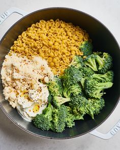 broccoli, macaroni and cheese in a pan