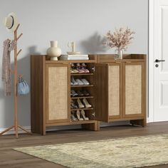 a wooden cabinet with shoes on it in front of a white door and beige rug