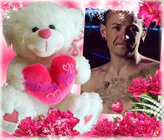 a man with tattoos holding a pink heart and a white teddy bear in front of him