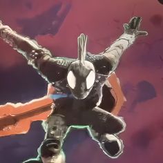 a spider - man flying through the air with his arms outstretched in front of him