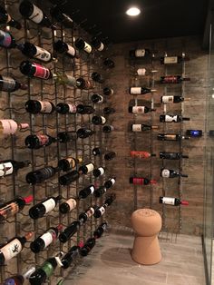 a wine rack with many bottles on it