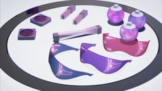 several different items are arranged on a circular table top, including purple and pink paint