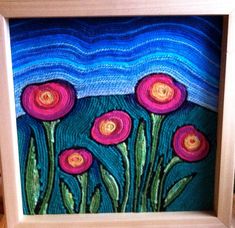 an image of some flowers painted on canvas in a wooden frame with blue and pink colors