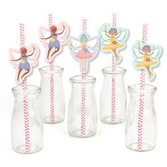 a group of glass vases filled with cupcake toppers and paper straws