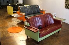 a living room filled with lots of furniture and decorating items on top of hard wood flooring