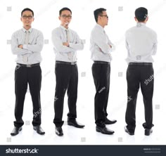 four men in business attire standing with their arms crossed