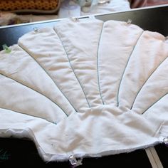 a close up of a cloth fan on a table