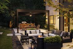 an outdoor living area with furniture and lighting