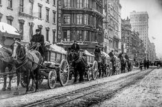 an old photo of horse drawn carriages on a city street in the early 1900's