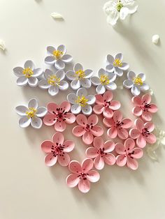 a bunch of paper flowers on a table