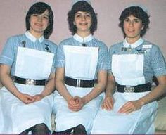 three women dressed in nurses uniforms posing for a photo