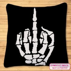 a black and white pillow that has a hand holding a knife on it, with the words symbolic image not a photo