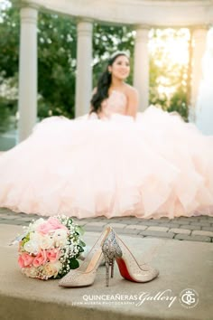 a bride's shoes and bouquet on the ground in front of a gazebo