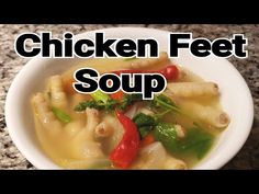 chicken feet soup in a white bowl on a granite counter top with the words chicken feet soup above it