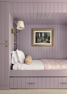 a bedroom with purple walls and white bedding