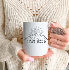 If you are looking for the perfect Stay wild mug,Stay wild stay free,Stay wild moon child,Hiking coffee mug,Co worker christmas,co worker leaving,Hiking gift,gift for her,cup, then look no further!  Bring the spirit of the great outdoors to your coffee break! This 11oz mug features a beautiful sketch of mountains with the inspiring words "Stay Wild" written underneath. Perfect for adventurers, nature lovers, and dreamers, this mug reminds you to keep your wild spirit alive every day. ✨ Key Featu Sketch Of Mountains, Hiking Coffee, Co Worker Leaving, Stay Wild Moon Child, Beautiful Sketches, Wild Moon, Hiking Gifts, Wild Spirit, Stay Wild