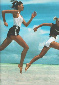 two women are running in the air on a cloudy day