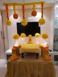 a bed with yellow and orange decorations on it