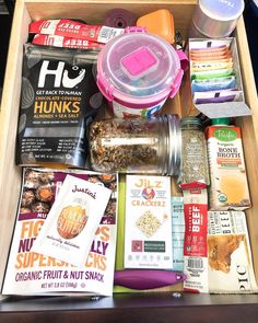 a drawer filled with snacks and other items