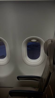 an airplane seat with two windows on it