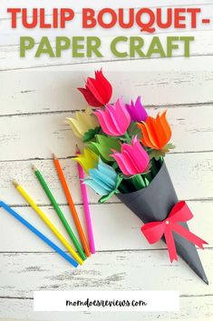 tulip bouquet paper craft with colored pencils on white wood background and text overlay that reads tulip bouquet paper craft