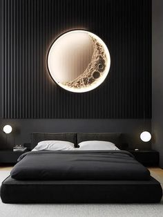 a large bed sitting in a bedroom next to a wall with a moon on it